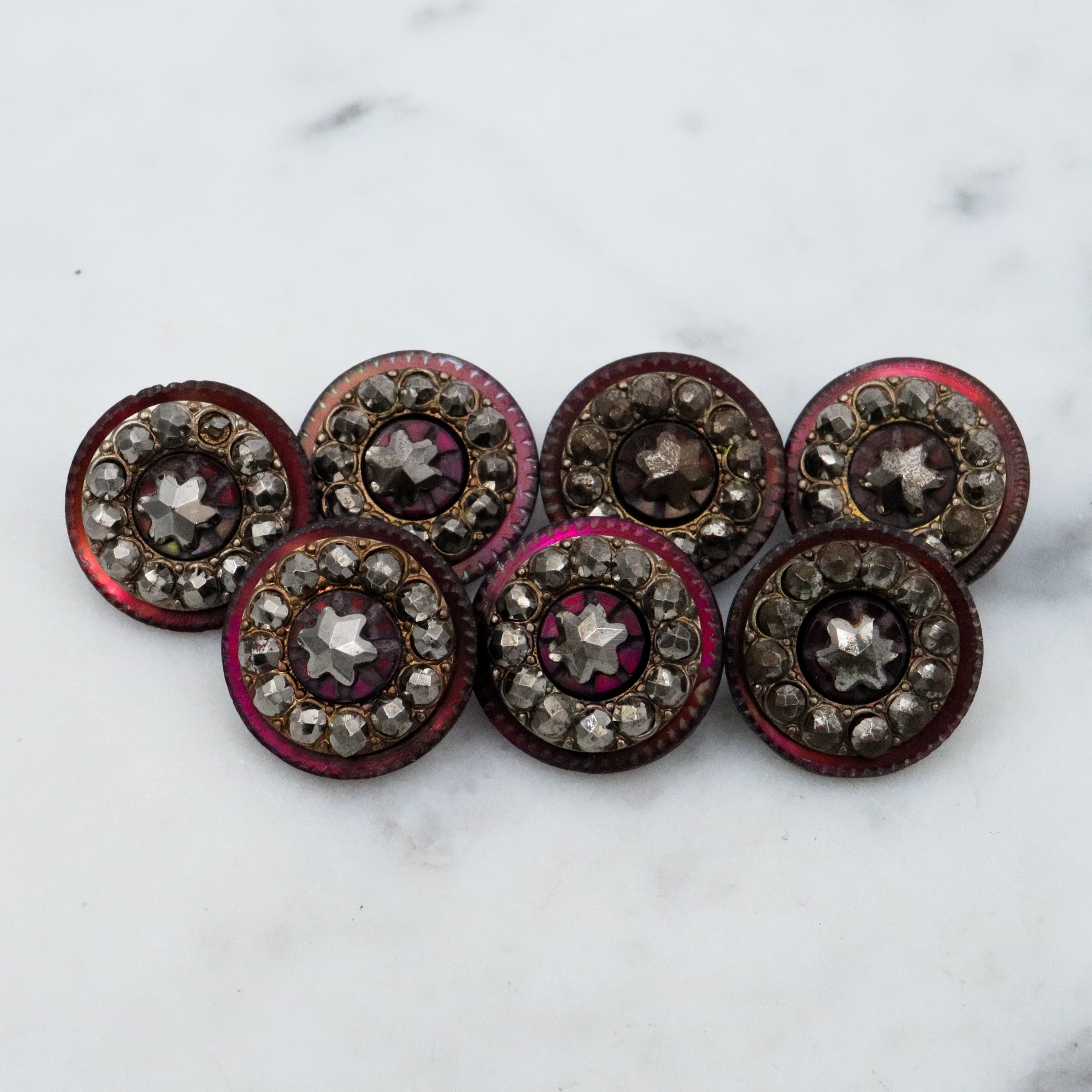 Set of 7 Antique Victorian purple shell cut steel rivet buttons